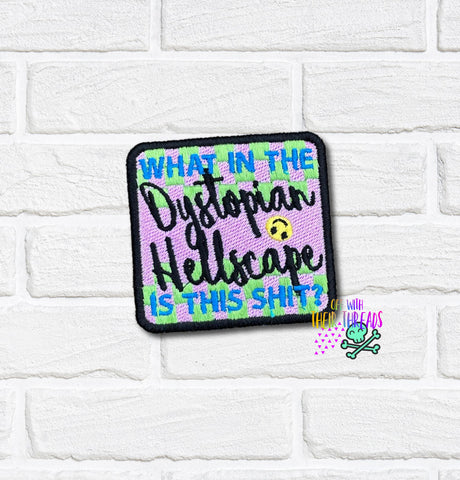 Embroidered patch with text on a white brick background